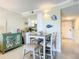 Dining area featuring a table and chairs, and decorations with a nautical theme at 3100 Ocean Shore Blvd # 4030, Ormond Beach, FL 32176