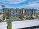 Beachfront condo featuring multiple balconies, covered parking, and lush landscaping at 3100 Ocean Shore Blvd # 4030, Ormond Beach, FL 32176