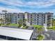 Beachfront condo with multiple balconies, covered parking, and lush landscaping at 3100 Ocean Shore Blvd # 4030, Ormond Beach, FL 32176