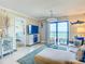 Comfortable living room area with balcony access and ocean views, leading into bedroom at 3100 Ocean Shore Blvd # 4030, Ormond Beach, FL 32176