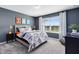 This bedroom includes a large window for natural light and bright and colorful decorations at 3156 Emerald Acres Ln, Sanford, FL 32771