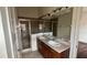 Bathroom features double sink vanity, tiled floors, and glass-enclosed shower at 3166 Riachuelo Ln, Kissimmee, FL 34744
