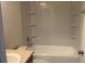 Well-lit bathroom featuring a tub, shower, and a vanity with sink at 3166 Riachuelo Ln, Kissimmee, FL 34744