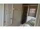 Bathroom with double sinks, a shower with sliding glass doors, and neutral wall color at 3166 Riachuelo Ln, Kissimmee, FL 34744