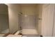 Clean bathroom features a shower and tub with white subway tiles and built in shelving at 3166 Riachuelo Ln, Kissimmee, FL 34744
