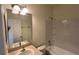 Bathroom featuring a sink, shower with white subway tiles, and bright lighting at 3166 Riachuelo Ln, Kissimmee, FL 34744