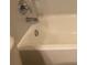 Close-up of white bathtub and chrome fixtures at 3166 Riachuelo Ln, Kissimmee, FL 34744