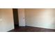 Cozy bedroom featuring wood-look flooring and neutral wall color, next to the closet at 3166 Riachuelo Ln, Kissimmee, FL 34744