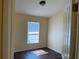 A small bedroom has hard wood floors and a window for natural light at 3166 Riachuelo Ln, Kissimmee, FL 34744