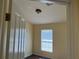 Cozy bedroom featuring wood-look floors and a bright window with blinds at 3166 Riachuelo Ln, Kissimmee, FL 34744