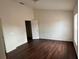Bedroom featuring vinyl floors, base molding, a window, and closet at 3166 Riachuelo Ln, Kissimmee, FL 34744