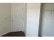 A standard-sized closet with a white door and hanging rack at 3166 Riachuelo Ln, Kissimmee, FL 34744