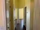 A long hallway has rooms on either side, all with hard wood floors at 3166 Riachuelo Ln, Kissimmee, FL 34744