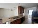 Kitchen with stainless steel double sink, tiled floors, and modern appliances at 3166 Riachuelo Ln, Kissimmee, FL 34744