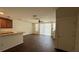 Bright living room features vinyl floors, fan, sliding glass door, and breakfast bar at 3166 Riachuelo Ln, Kissimmee, FL 34744