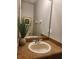Bathroom vanity featuring granite countertops, large mirror and ample lighting at 3500 Calabria Ave, Davenport, FL 33897