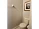 Cozy powder room features a sleek toilet and minimalist decor at 3500 Calabria Ave, Davenport, FL 33897
