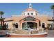 Front view of the Regal Palms clubhouse with a fountain and well-manicured landscaping at 3500 Calabria Ave, Davenport, FL 33897