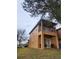 Exterior of a two story home with a balcony overlooking a lush green space at 3500 Calabria Ave, Davenport, FL 33897