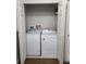 A laundry closet with a washer and dryer, and bi-fold doors at 3500 Calabria Ave, Davenport, FL 33897