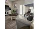 Cozy living room showcasing a neutral color palette, comfortable seating, and stylish decor, creating a relaxing atmosphere at 3500 Calabria Ave, Davenport, FL 33897
