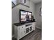 Comfortable living room showcasing a large flat-screen TV on a stylish console with storage and decorative elements at 3500 Calabria Ave, Davenport, FL 33897
