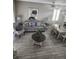 Open-concept living space with a sofa, table, and dining area with seating, creating a spacious and inviting atmosphere at 3500 Calabria Ave, Davenport, FL 33897