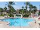 Large pool area with people swimming and a waterslide in a Gathering-friendly resort at 3500 Calabria Ave, Davenport, FL 33897