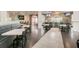 Restaurant area featuring bench seating and multiple tables for dining with guests at 3500 Calabria Ave, Davenport, FL 33897