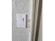 A standard light switch on a textured wall at 3500 Calabria Ave, Davenport, FL 33897