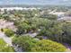 Aerial view of the property surrounded by mature trees, landscaping, and neighborhood at 3520 N Westmoreland Dr, Orlando, FL 32804