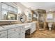 Bright bathroom featuring double vanities and a glass shower at 3520 N Westmoreland Dr, Orlando, FL 32804