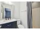 Bathroom featuring dark vanity with double sinks, shower-tub combo with new finishes at 3520 N Westmoreland Dr, Orlando, FL 32804