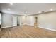 Well-lit bedroom showing three doors and hardwood floors at 3520 N Westmoreland Dr, Orlando, FL 32804