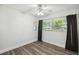 Bright bedroom featuring hardwood floors, ceiling fan, and natural light from updated windows at 3520 N Westmoreland Dr, Orlando, FL 32804