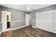 Bedroom featuring hardwood floors, an ample closet, and neutral colored walls at 3520 N Westmoreland Dr, Orlando, FL 32804