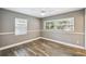 Bedroom featuring two windows that provide natural light and chair rail detail at 3520 N Westmoreland Dr, Orlando, FL 32804
