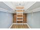 Chic closet with custom shelving and a modern chandelier at 3520 N Westmoreland Dr, Orlando, FL 32804