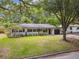 A well-maintained front lawn and mature trees enhance the curb appeal of this lovely home at 3520 N Westmoreland Dr, Orlando, FL 32804
