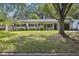 Charming single-story home boasts a tidy lawn and mature trees enhancing curb appeal at 3520 N Westmoreland Dr, Orlando, FL 32804