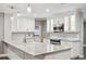 The updated kitchen boasts modern cabinets, granite countertops, and stainless steel appliances at 3520 N Westmoreland Dr, Orlando, FL 32804