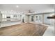 Open-concept space with hardwood floors connects living room, kitchen, and backyard at 3520 N Westmoreland Dr, Orlando, FL 32804