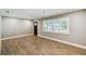 Bright living room showcases stylish wood-look flooring, neutral walls, and plantation shutters at 3520 N Westmoreland Dr, Orlando, FL 32804