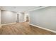 Spacious living area features wood-look flooring and neutral walls, leading into the kitchen at 3520 N Westmoreland Dr, Orlando, FL 32804