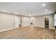Spacious main bedroom with hardwood floors leading to an ensuite bathroom and closet at 3520 N Westmoreland Dr, Orlando, FL 32804
