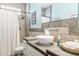 Bathroom featuring stylish vessel sink, tiled shower with glass block window and modern fixtures at 40137 County Road 452, Leesburg, FL 34788