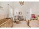 Charming Bedroom decorated with a daisy theme, includes a crib and a rocking chair at 40137 County Road 452, Leesburg, FL 34788