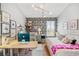 Stylish bedroom with a desk area, palm wallpaper and modern lighting fixture at 40137 County Road 452, Leesburg, FL 34788