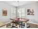Charming dining area with rustic wooden table, accent lighting, and stylish decor at 40137 County Road 452, Leesburg, FL 34788