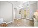 Bright and airy foyer with soaring ceilings and elegant tile flooring at 40137 County Road 452, Leesburg, FL 34788